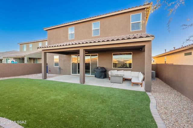 back of property featuring a yard, a patio area, and outdoor lounge area