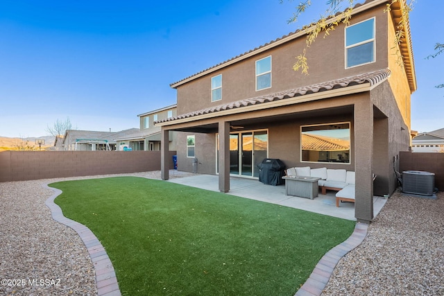 rear view of house with cooling unit, a patio area, outdoor lounge area, and a lawn