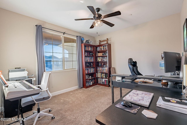 office featuring light carpet and ceiling fan