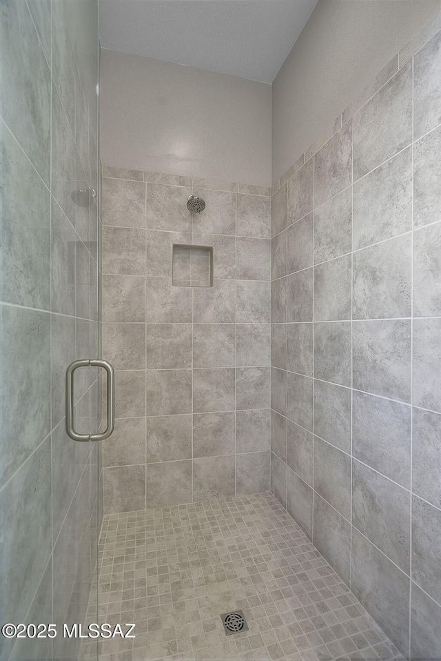 bathroom featuring an enclosed shower