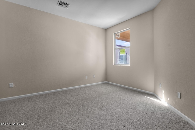 empty room with carpet flooring