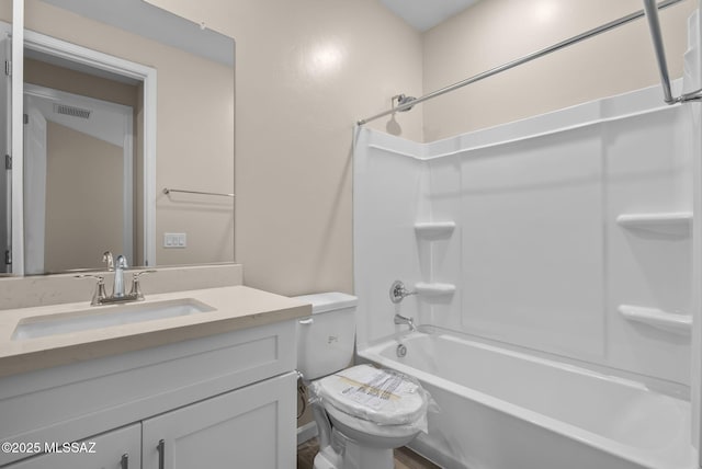 full bathroom featuring vanity, toilet, and bathtub / shower combination