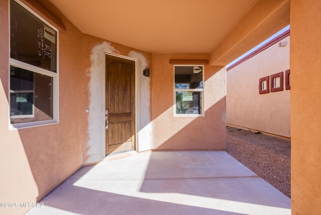 doorway to property featuring a patio