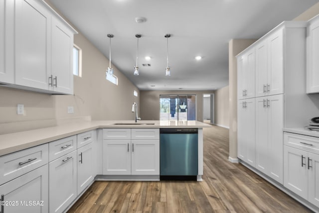 kitchen with sink, pendant lighting, white cabinets, and dishwasher