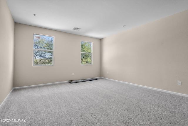 unfurnished room with carpet flooring