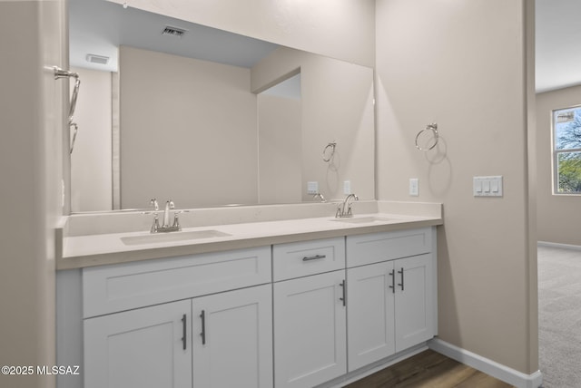 bathroom featuring vanity and wood-type flooring