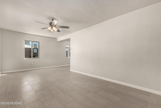 unfurnished room with ceiling fan