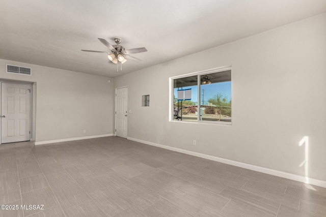 spare room with ceiling fan