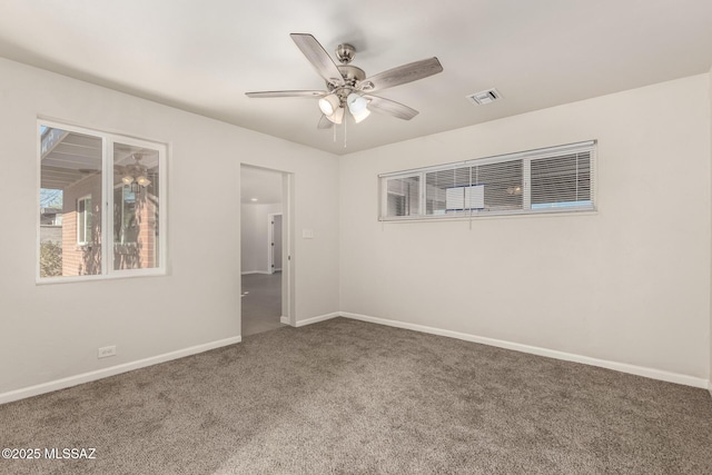 spare room with ceiling fan and carpet floors