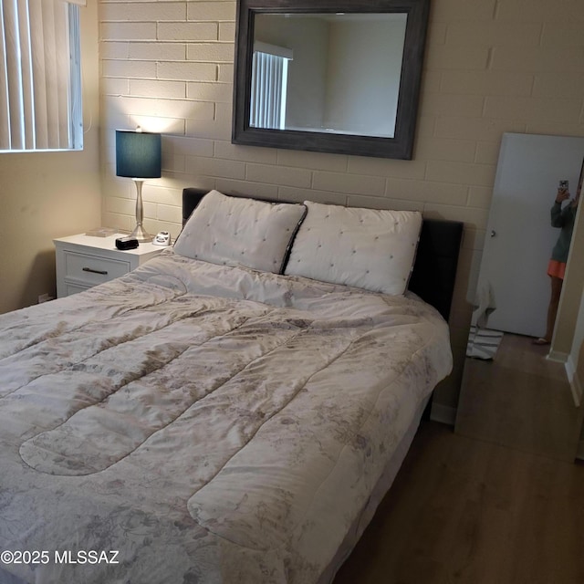 bedroom with hardwood / wood-style flooring