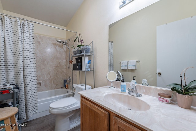 full bathroom featuring wood finished floors, shower / tub combo, vanity, and toilet