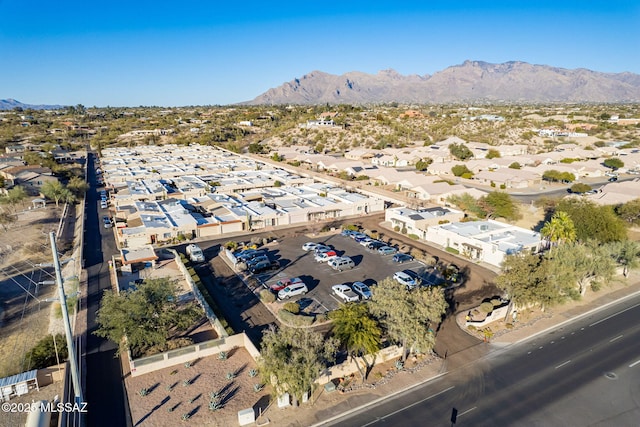 drone / aerial view featuring a residential view and a mountain view