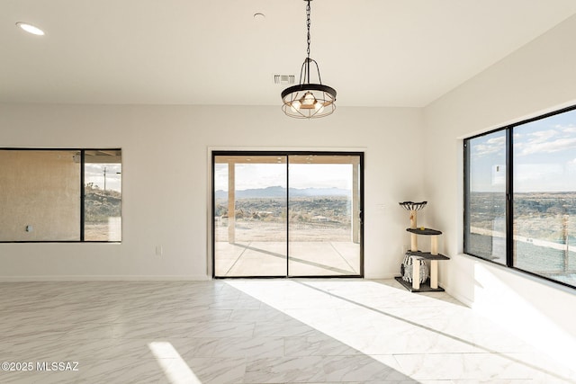 interior space featuring an inviting chandelier and a mountain view