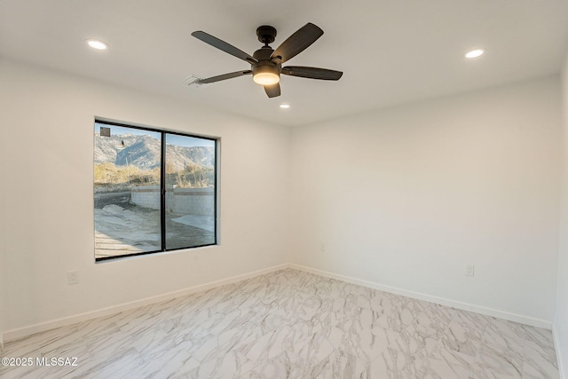 spare room with ceiling fan