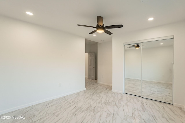 unfurnished bedroom featuring ceiling fan and a closet