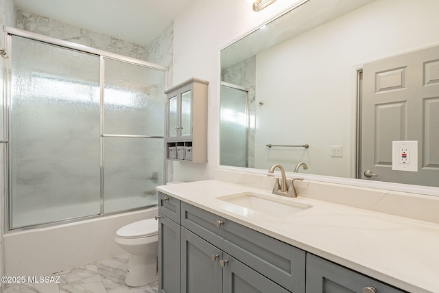 full bathroom featuring toilet, bath / shower combo with glass door, a healthy amount of sunlight, and vanity