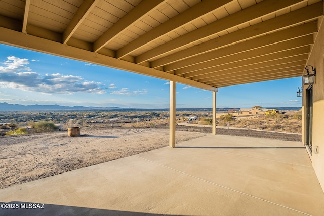 view of patio / terrace featuring a mountain view