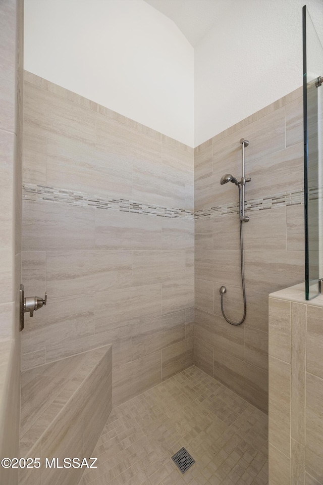 bathroom featuring tiled shower