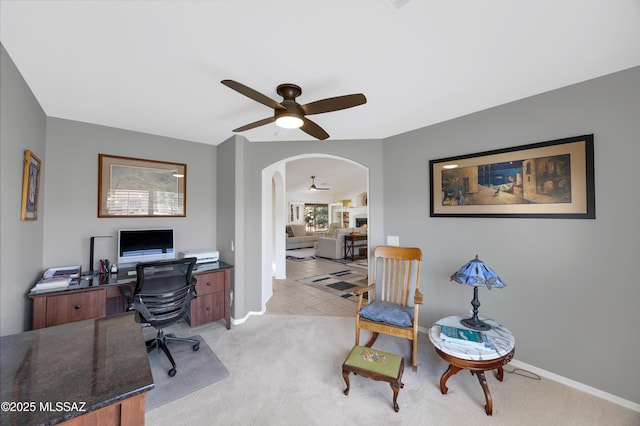 carpeted office with ceiling fan