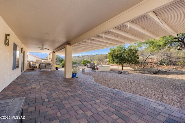 view of patio / terrace featuring ceiling fan and outdoor lounge area