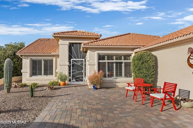 rear view of house with a patio area