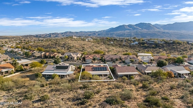 birds eye view of property featuring a mountain view