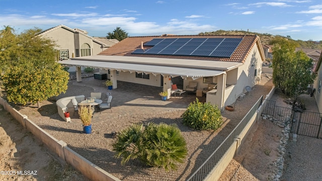 exterior space with a patio area and solar panels