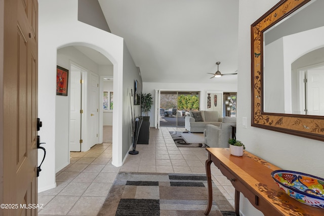 tiled entryway with ceiling fan