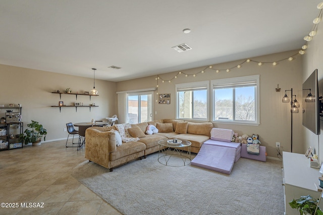 living room with light tile patterned floors