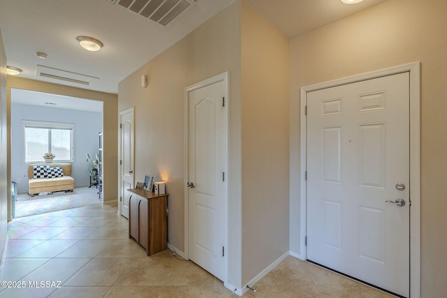 corridor with light tile patterned flooring