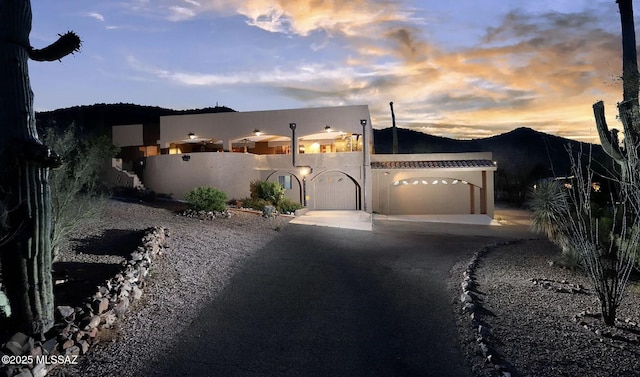 southwest-style home featuring a garage