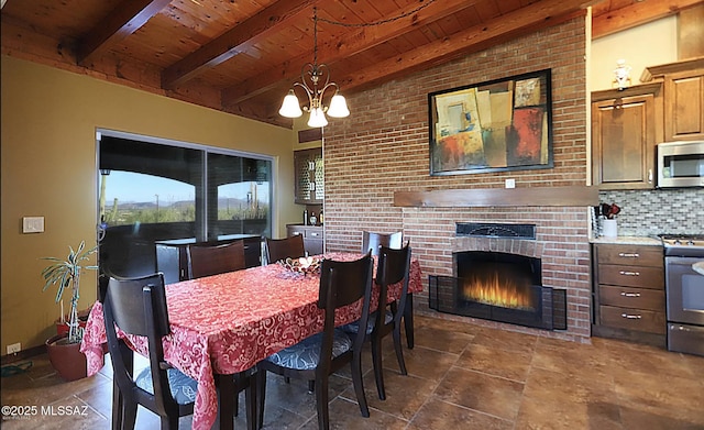 dining area with beamed ceiling, wooden ceiling, a fireplace, and a notable chandelier