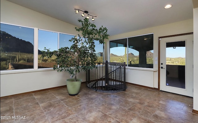 sunroom / solarium with a mountain view