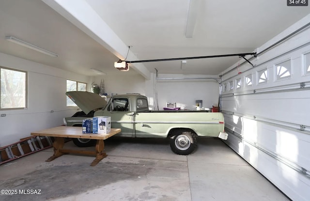 garage featuring a garage door opener