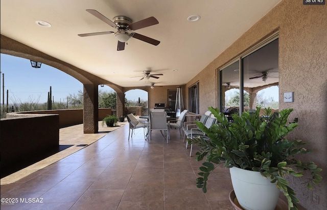 view of patio with ceiling fan