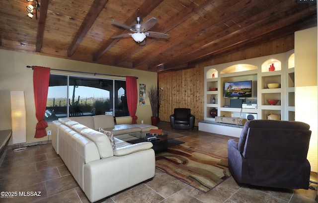 living room with built in shelves, ceiling fan, beam ceiling, and wooden ceiling