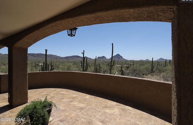 view of patio with a mountain view