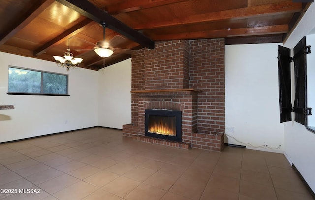 unfurnished living room with lofted ceiling with beams, a brick fireplace, tile patterned flooring, and wooden ceiling