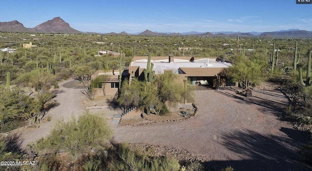 birds eye view of property with a mountain view