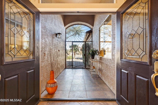 foyer entrance featuring tile patterned flooring