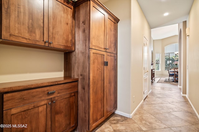 hallway with light tile patterned flooring