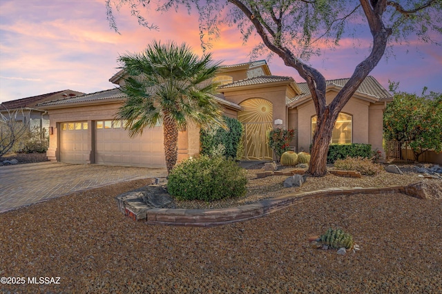 view of front of home with a garage