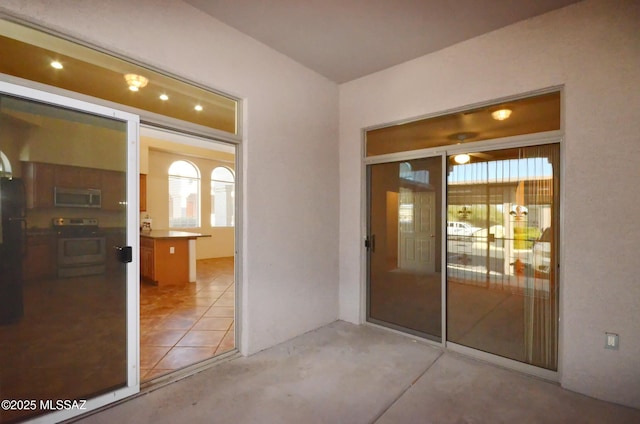 entrance to property with a patio