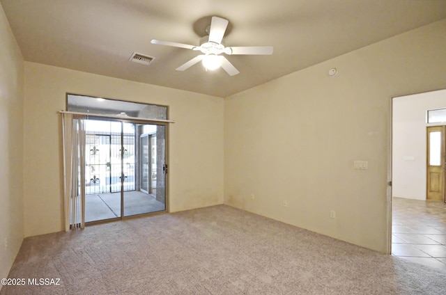 unfurnished room with ceiling fan and light carpet