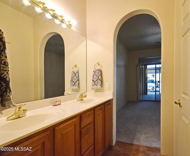 bathroom featuring tile patterned flooring and vanity