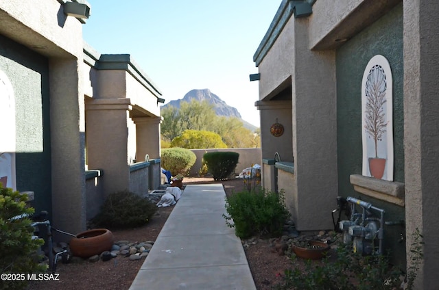 view of side of home with a mountain view