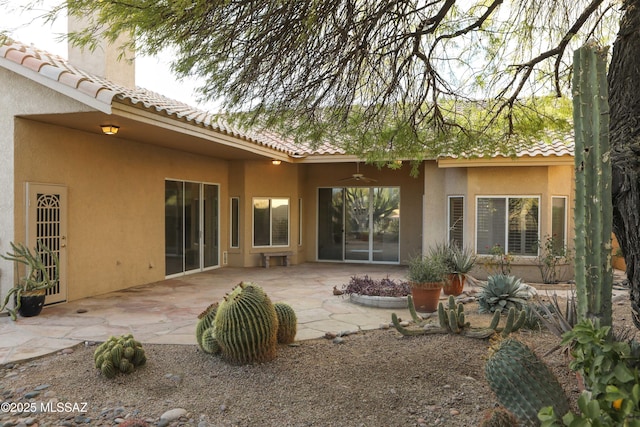 rear view of house featuring a patio