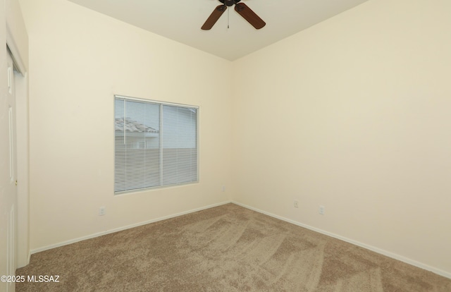 unfurnished room featuring ceiling fan and carpet flooring