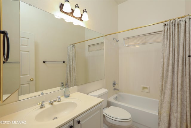 full bathroom with shower / bathtub combination with curtain, vanity, and toilet