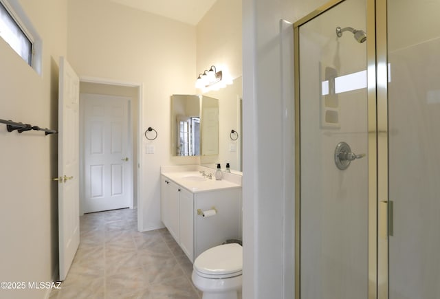 bathroom with vanity, tile patterned flooring, a shower with door, and toilet